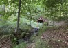 Dobrých 100 metrů houštinami jsme se probojovali ke studánce s lahodnou vodou.